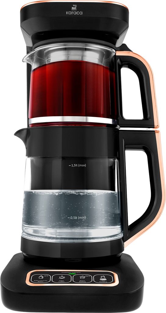 A product shot of a black and copper tea maker with red tea in the upper chamber and water in the lower chamber.