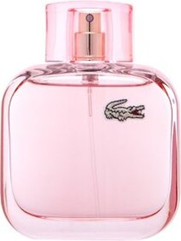 A pink perfume bottle with a gold spray nozzle and a crocodile logo.