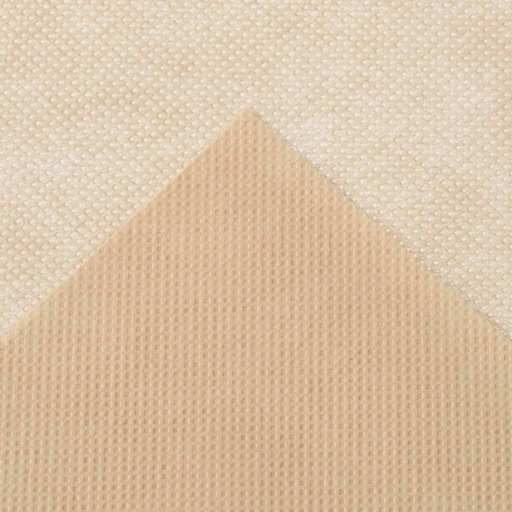 A close-up view of two textured materials, likely fabric or fleece, layered diagonally.