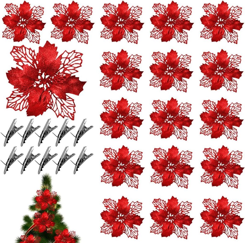 A collection of red artificial poinsettia flowers and silver clips arranged on a white background, with a small section of a Christmas tree visible at the bottom.