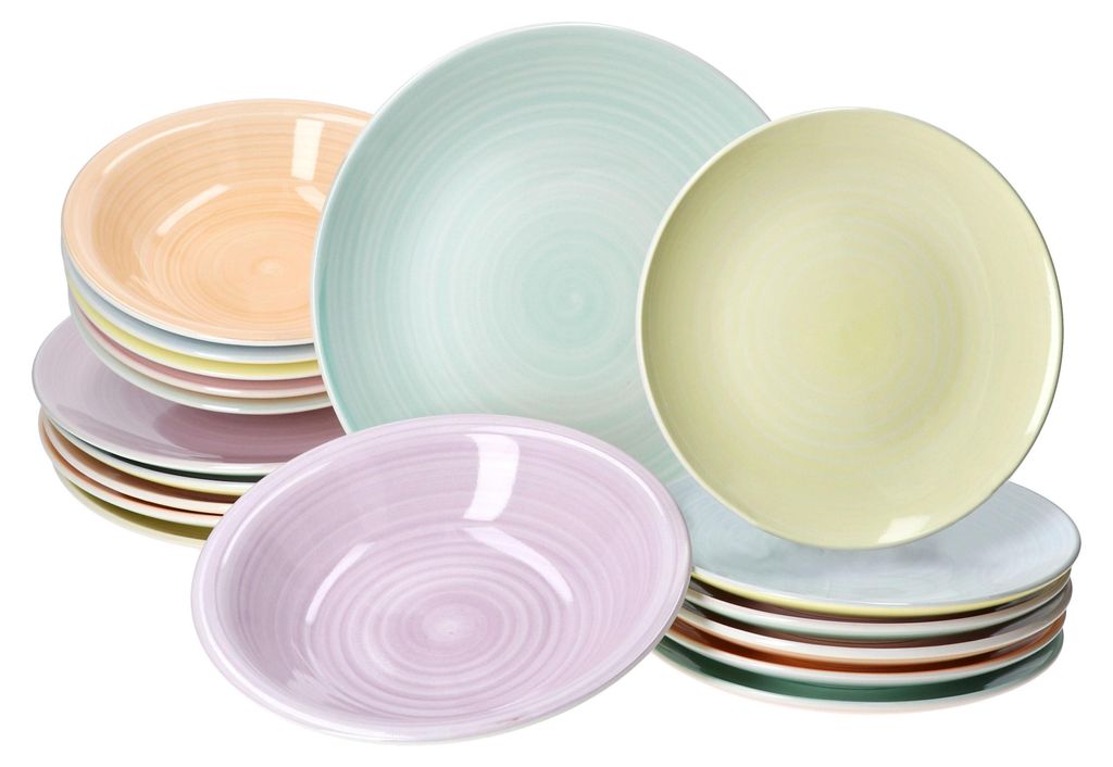 A collection of colorful ceramic plates and bowls stacked and arranged.