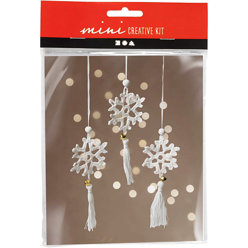 A product packaging containing a craft kit for making snowflake ornaments.