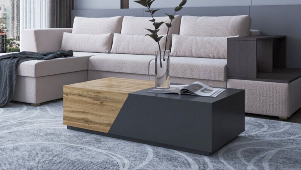 A modern living room scene featuring a sectional sofa and a coffee table.