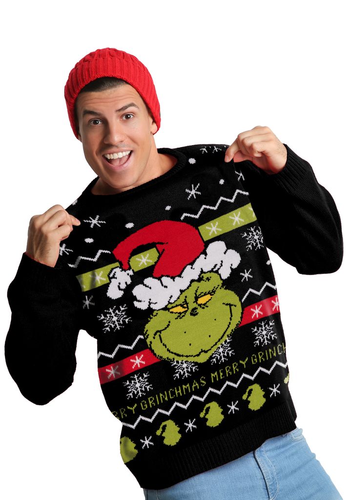 A man wearing a Grinch-themed Christmas sweater and a red beanie, posing for a product shot.