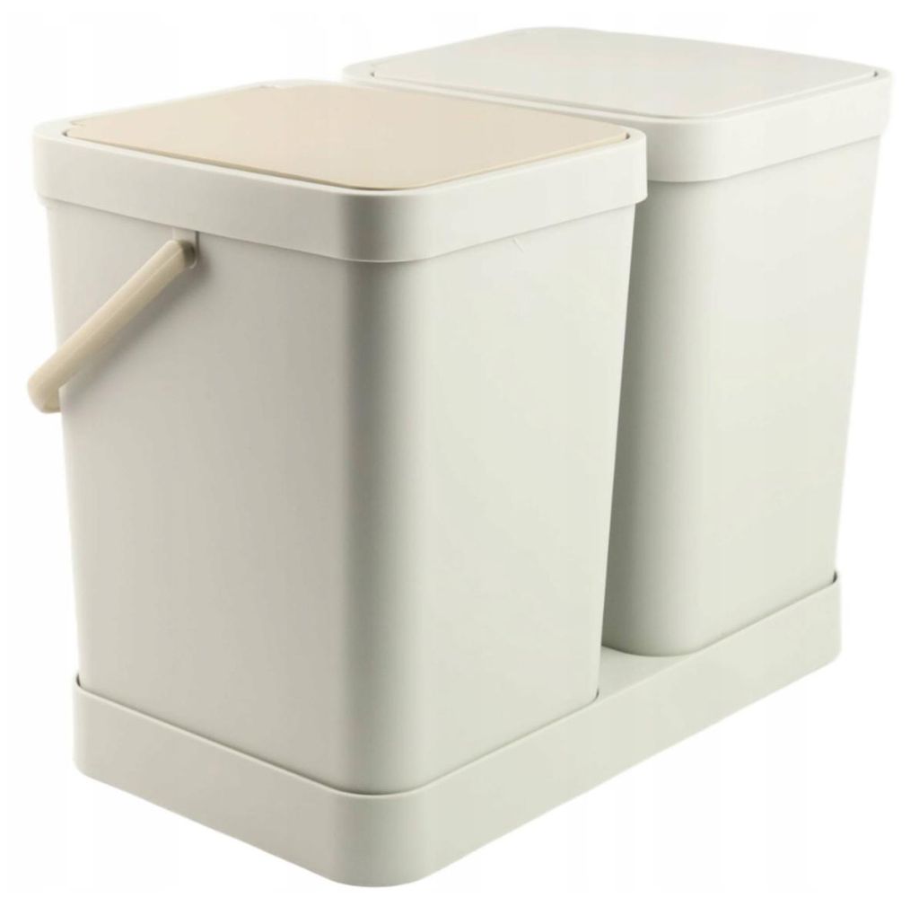 A pair of beige and cream colored trash cans with lids, sitting on a matching base.