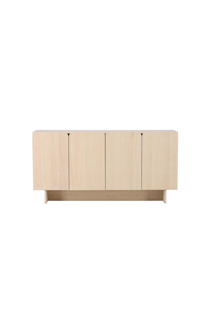 A light wood sideboard with four doors against a white background.