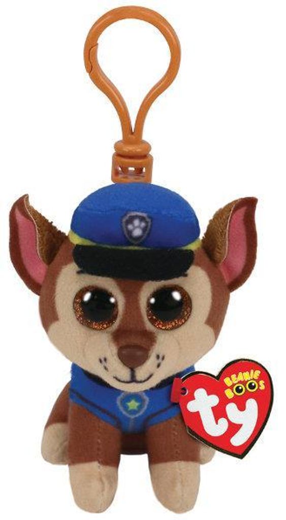 A plush toy dog wearing a police uniform and hat, with a clip attached to the top for hanging.