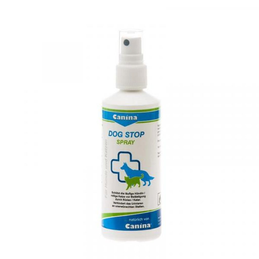 A white spray bottle with a blue and green label for dog repellent.