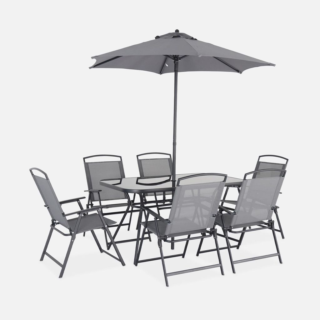 A grey outdoor dining set with a table, six chairs, and a parasol, presented against a plain white background.