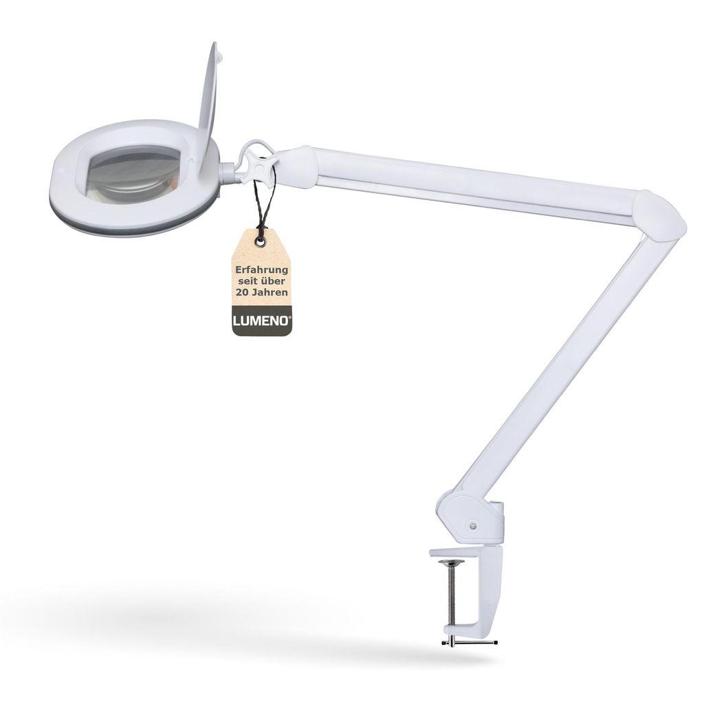 A white magnifying lamp with an adjustable arm and clamp base, shown against a white background. A tag with text is attached to the lamp.