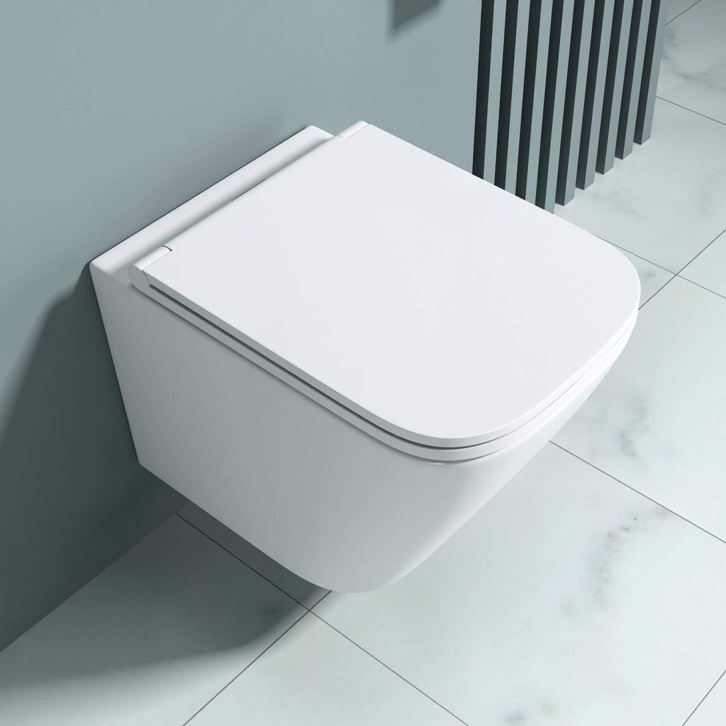 A modern, wall-mounted toilet in a bathroom setting with light gray walls and white tiled floor.