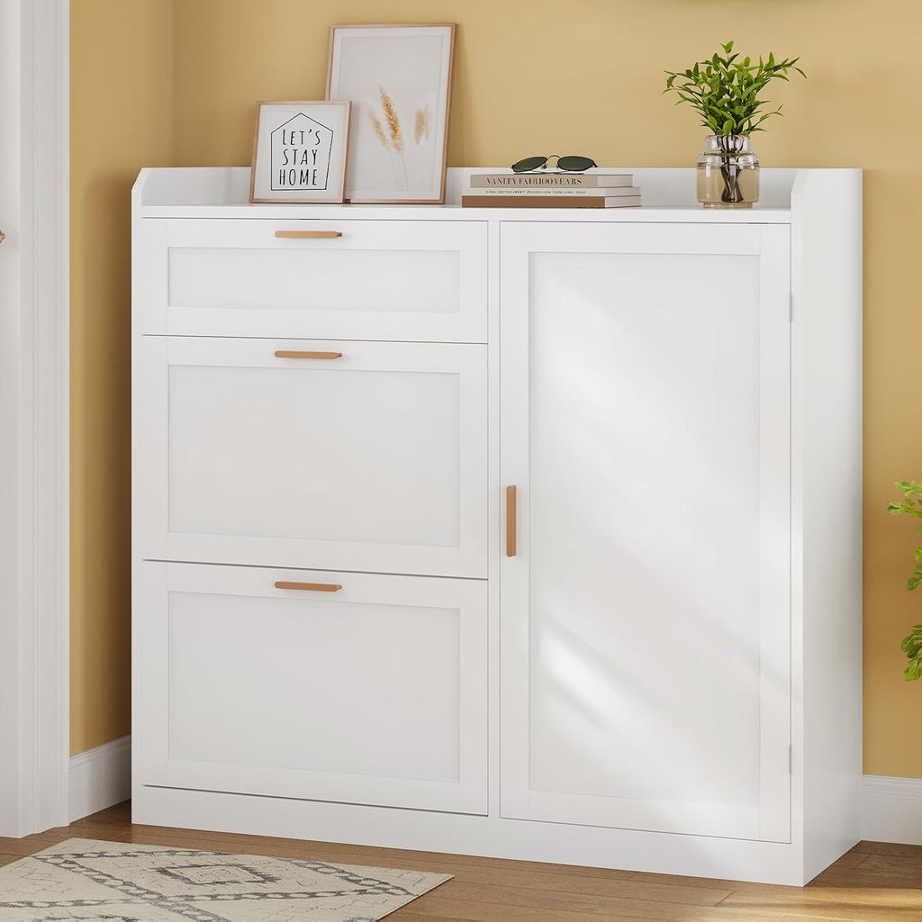 A white shoe cabinet with drawers and a door, placed against a yellow wall.