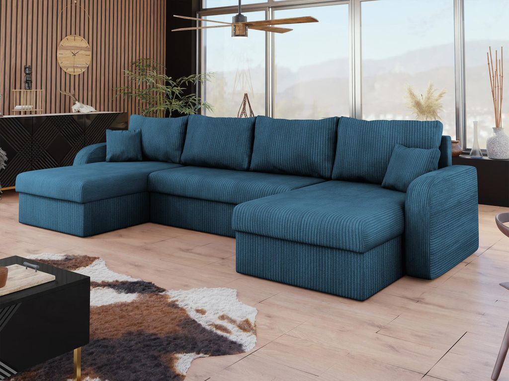 A U-shaped sectional sofa in a living room with a large window in the background.