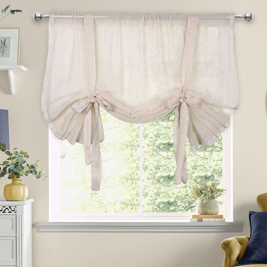 A tie-up shade window covering in a room.