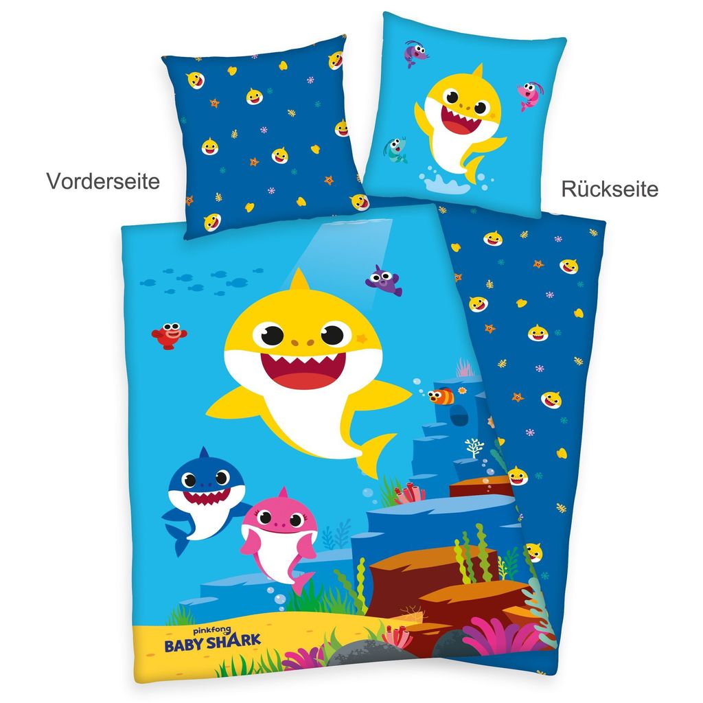 A Baby Shark themed bedding set, including a duvet cover and pillowcases, displayed flat.