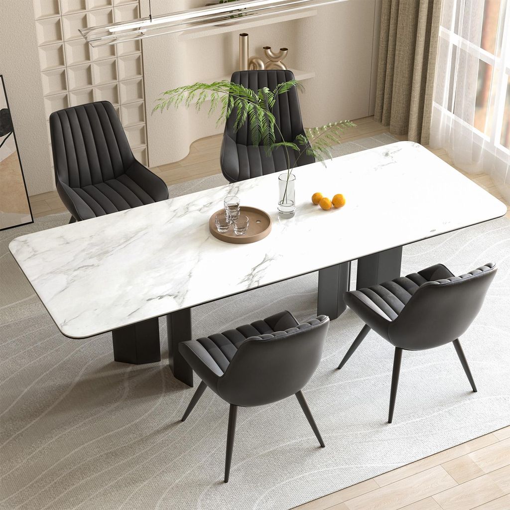 A dining table with chairs in a modern setting.
