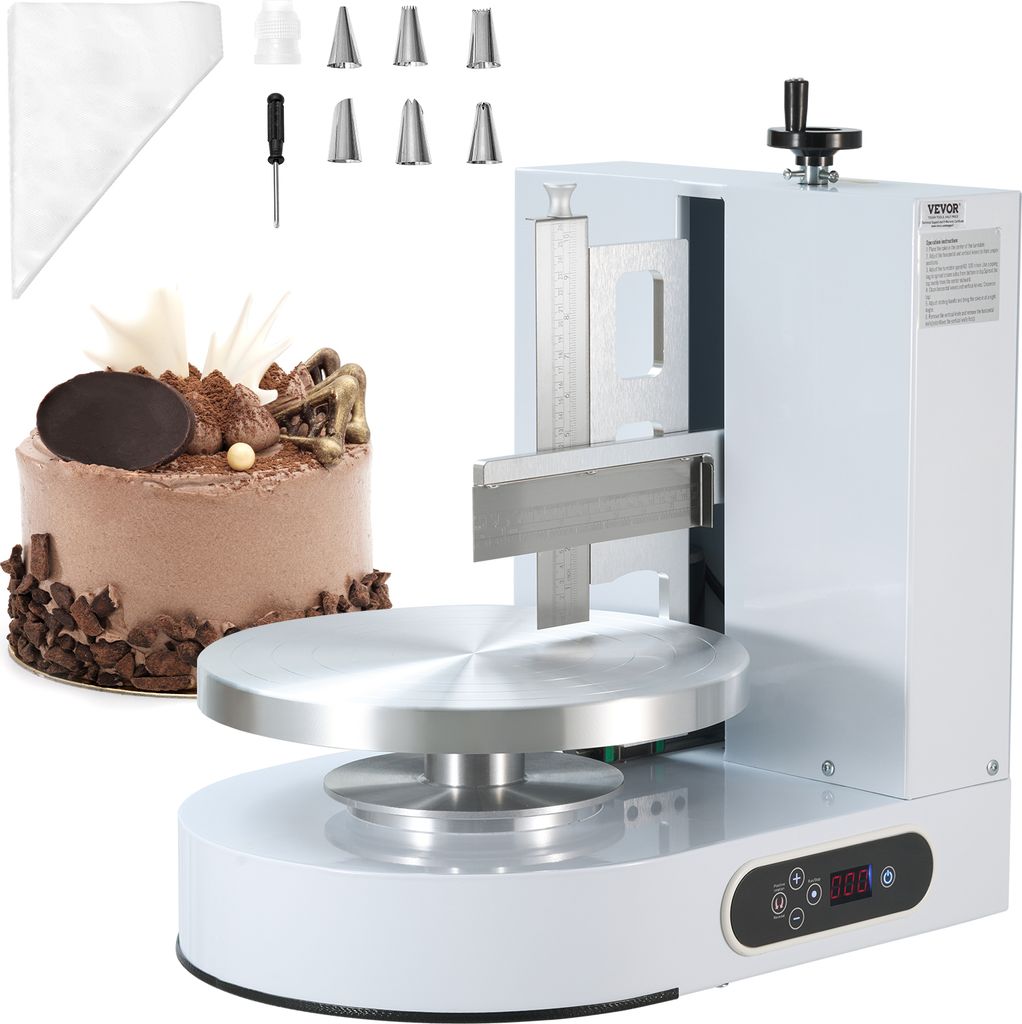 A cake decorating machine with a cake and accessories.