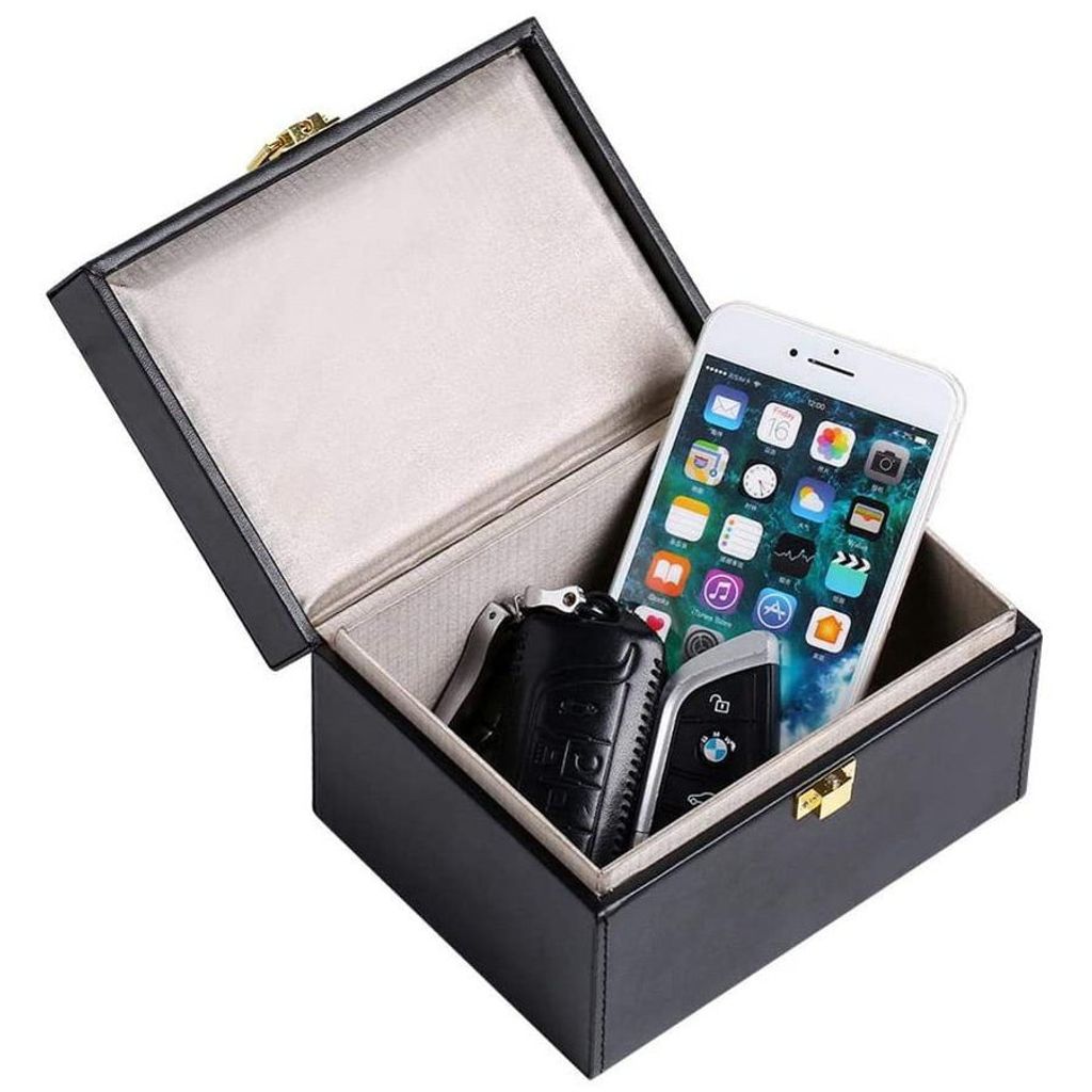 An open black box containing a smartphone and car keys.