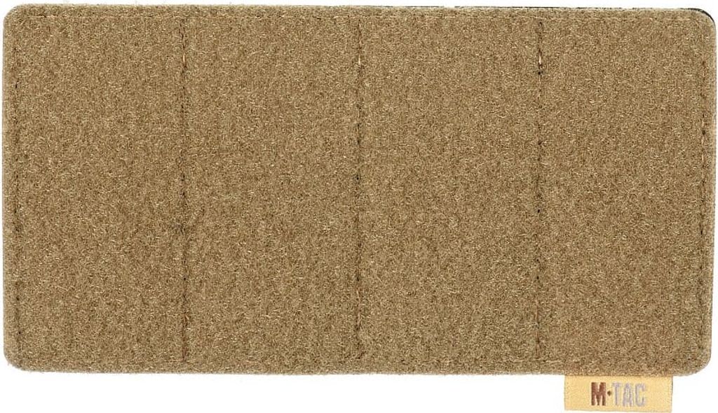 A flat lay image of a tan patch panel.