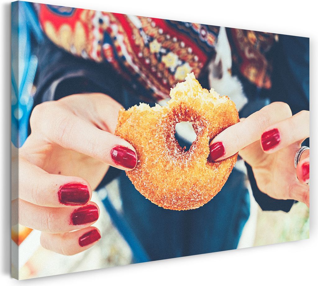 Leinwandbild (100x70cm): Essensbilder n Frau zeigt angebissenen Donut, echter Holz-Keilrahmen inkl. Aufhänger, handgefertigt in Deutschland