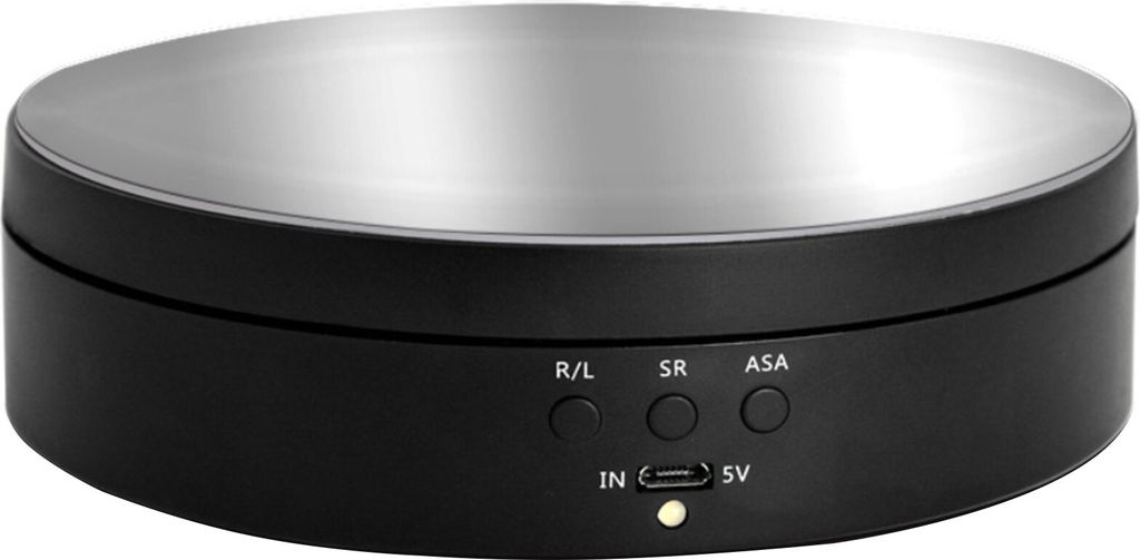 A black rotating display stand with a silver top surface, showing buttons and a USB port on the front.
