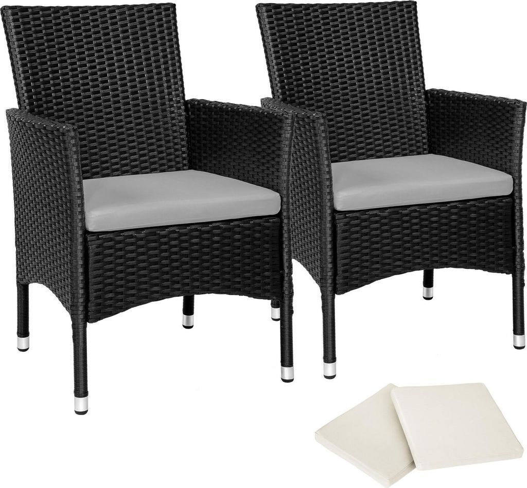 Two black rattan chairs with gray cushions are shown on a white background, with two additional beige cushions in the foreground.
