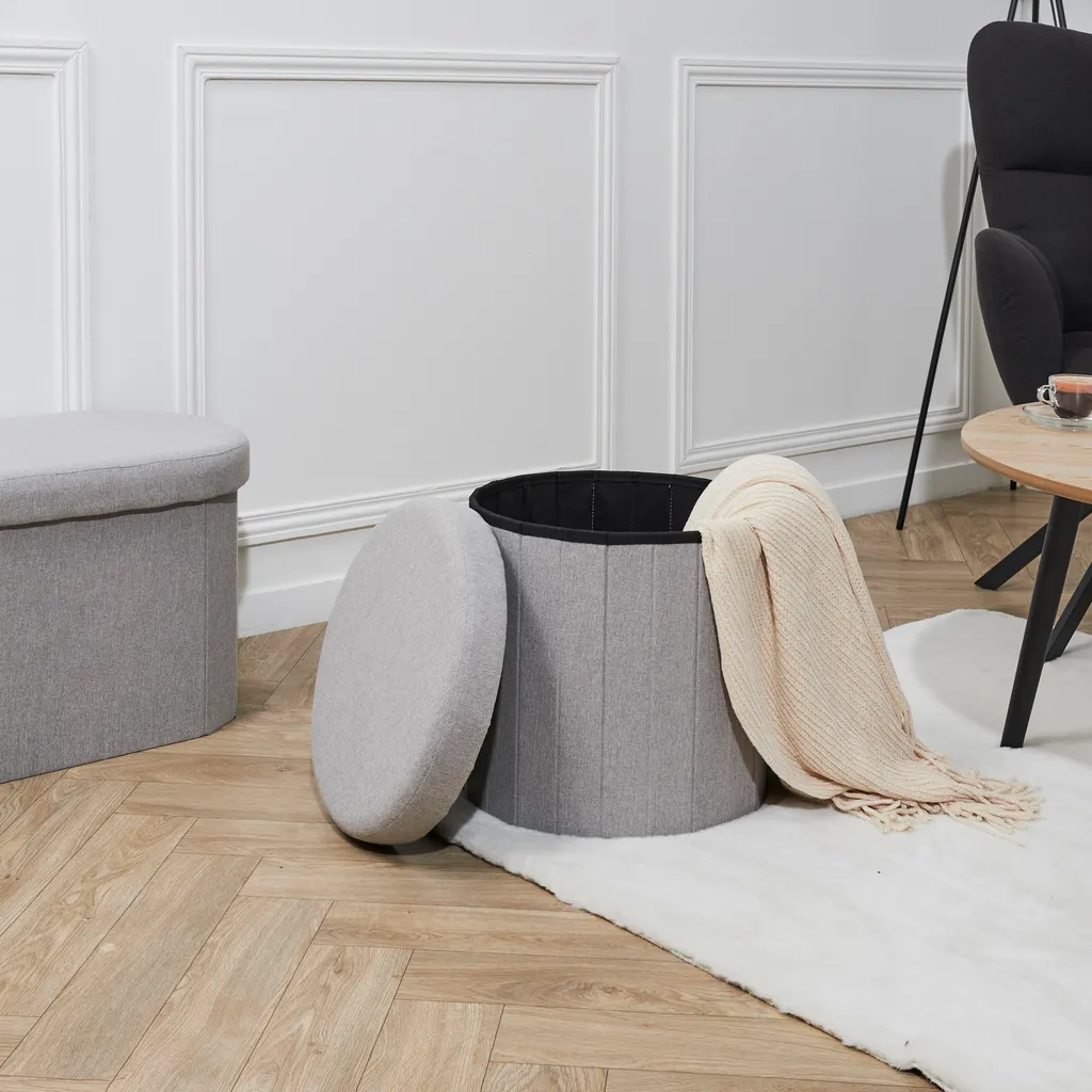 Coffre pouf pliable gris Pills pour un rangement élégant du salon