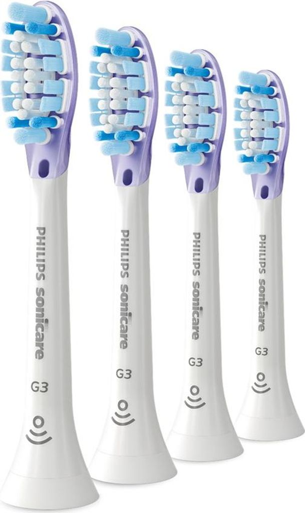 Four Philips Sonicare G3 toothbrush heads arranged diagonally.