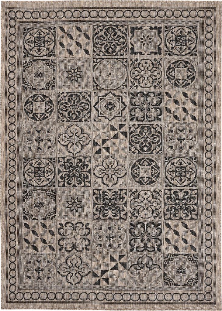 A flat lay of a rug with a geometric tile pattern.