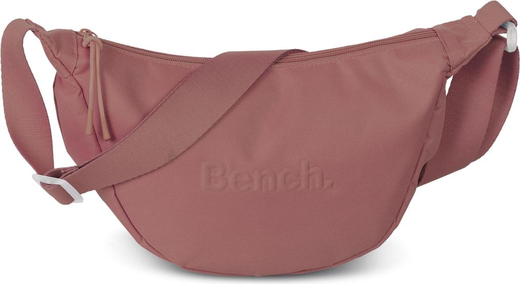 A studio shot of a pink crossbody bag.