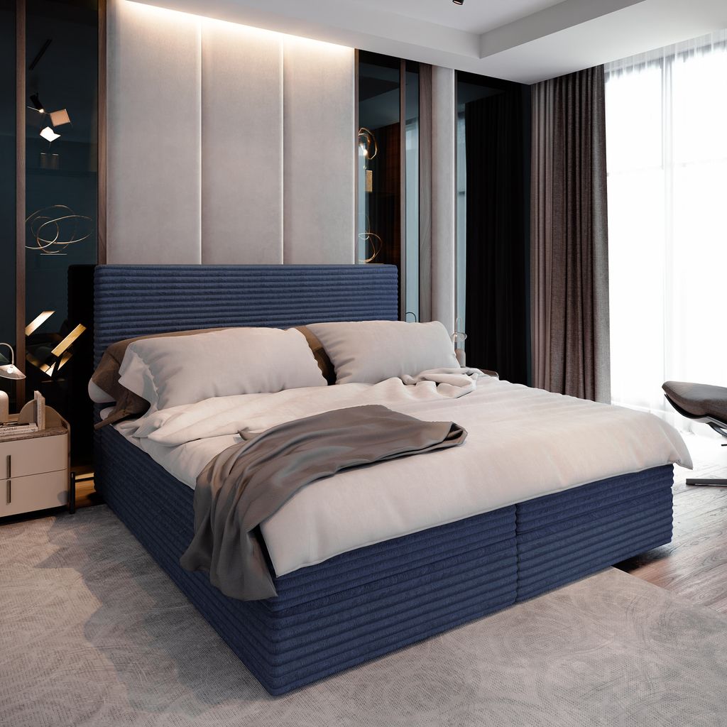 A bedroom scene with a large bed as the focal point.