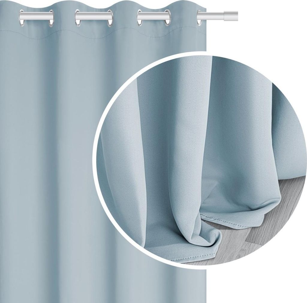 A close-up view of a light blue curtain, showing its texture and how it drapes.