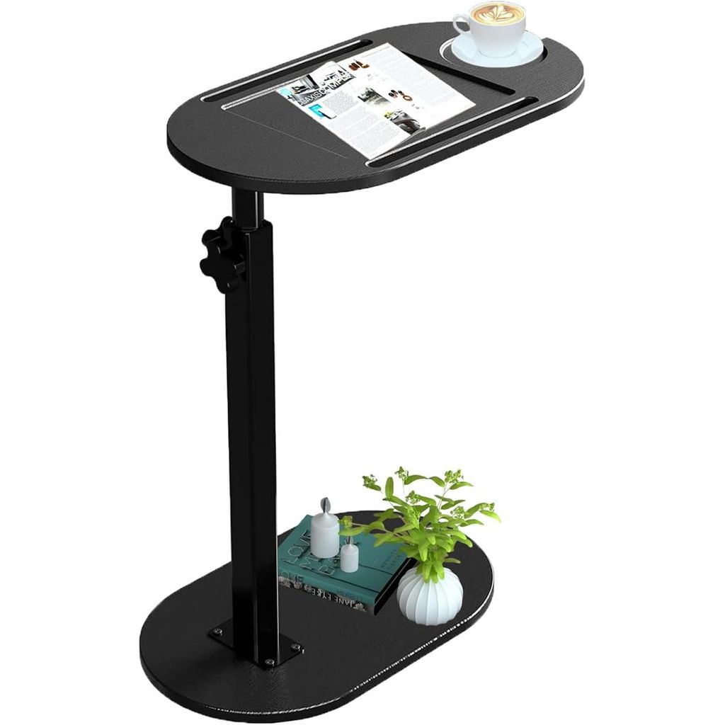 A black C-shaped side table with a cup of coffee and a magazine on top, and a plant and books on the lower shelf.