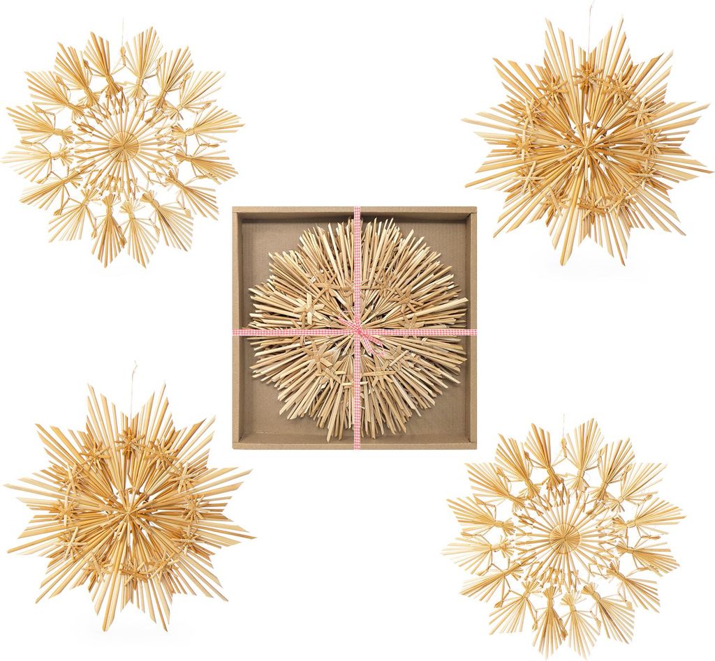 A collage of four straw star ornaments, one of which is in a box with pink ribbon.