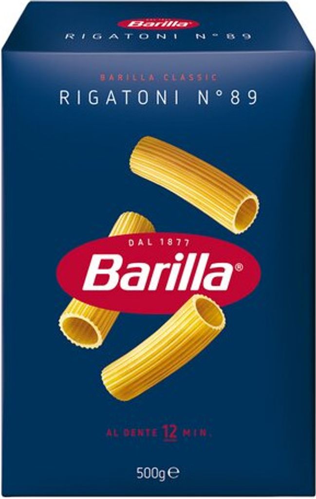 A product shot of a box of Barilla Rigatoni pasta, with three pieces of pasta shown floating in front of the box.