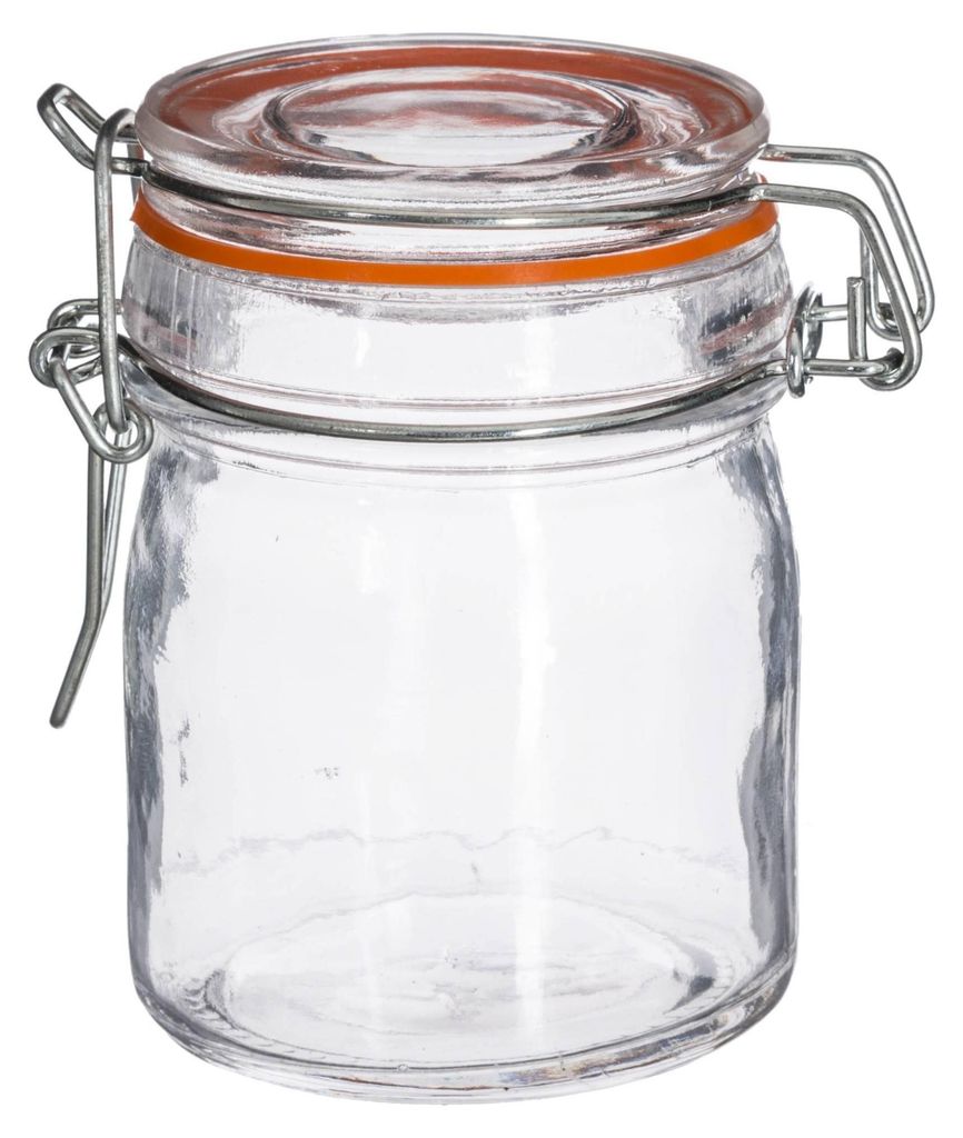 A clear studio shot of an empty glass jar with a clamp lid.