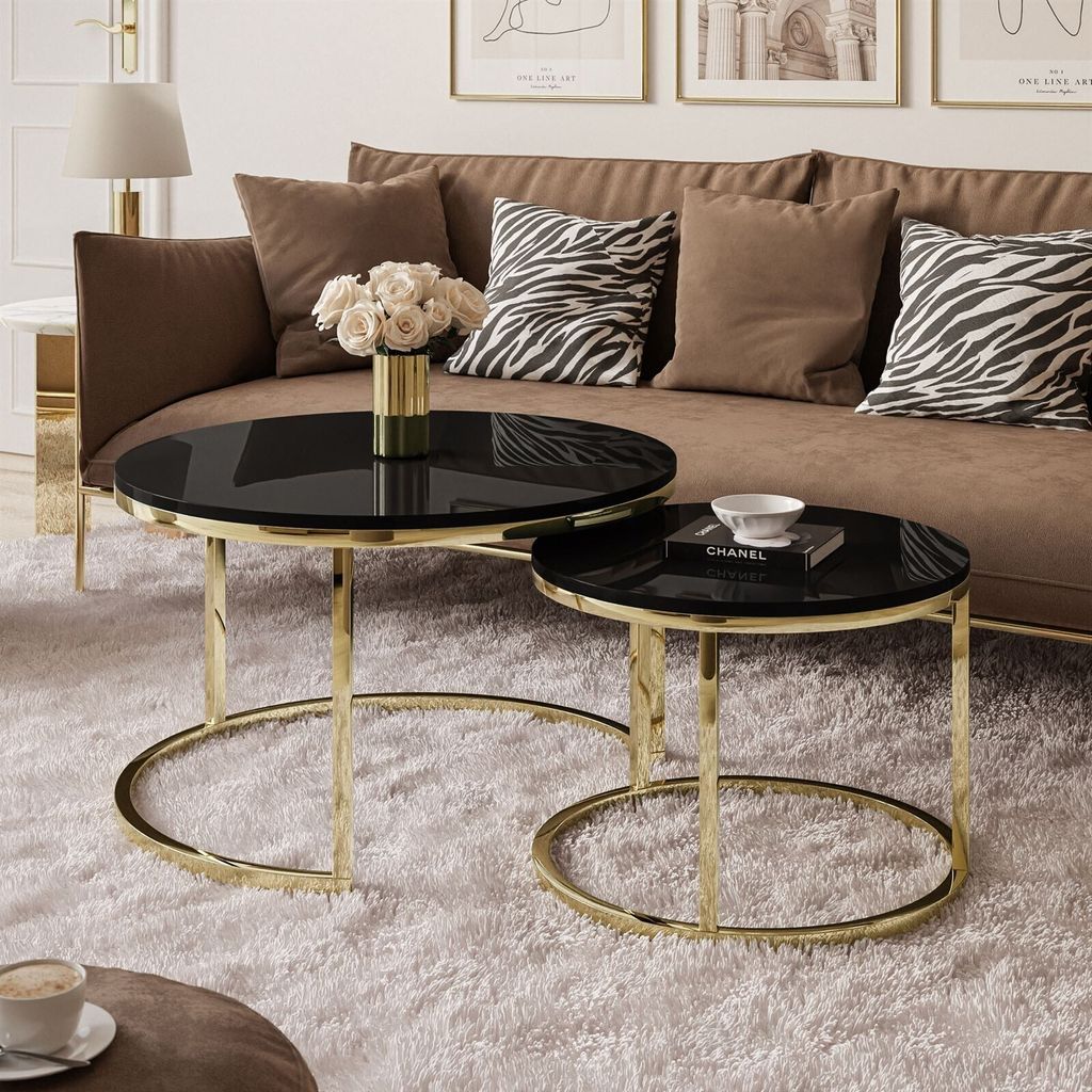 A living room scene with a sofa, coffee tables, and decorative items.