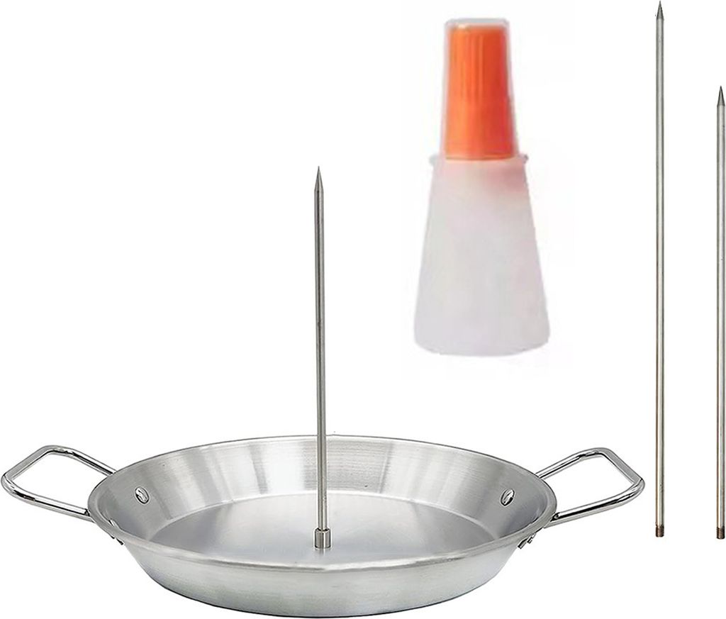 A set of vertical rotisserie skewers, a pan, and an oil bottle.