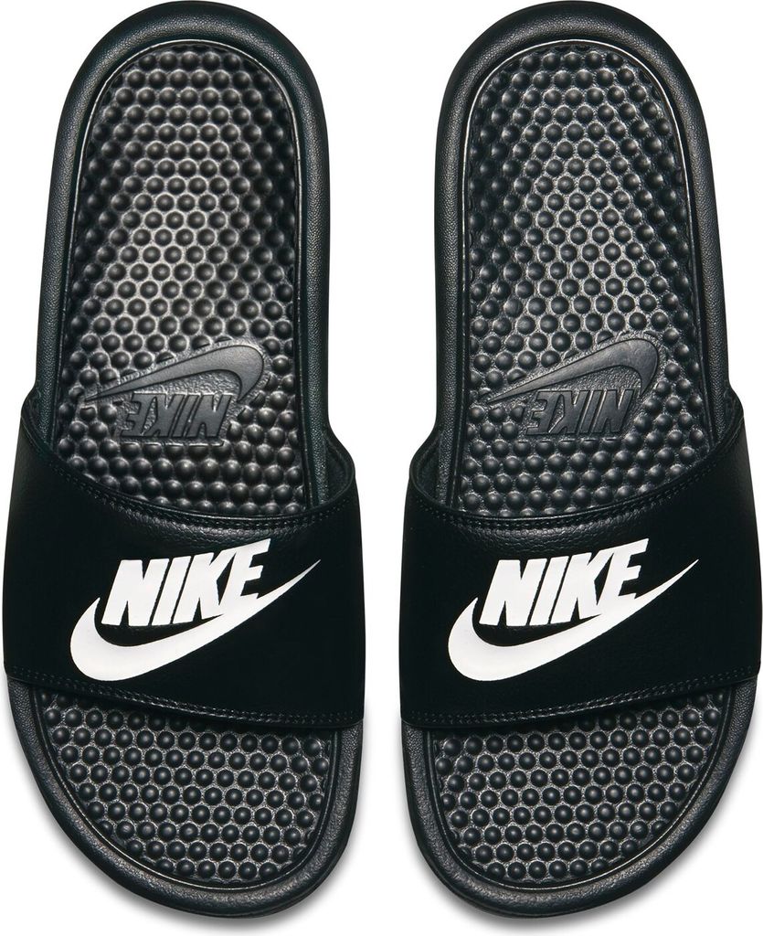 A pair of black Nike Benassi JDI slides with white Nike logos.