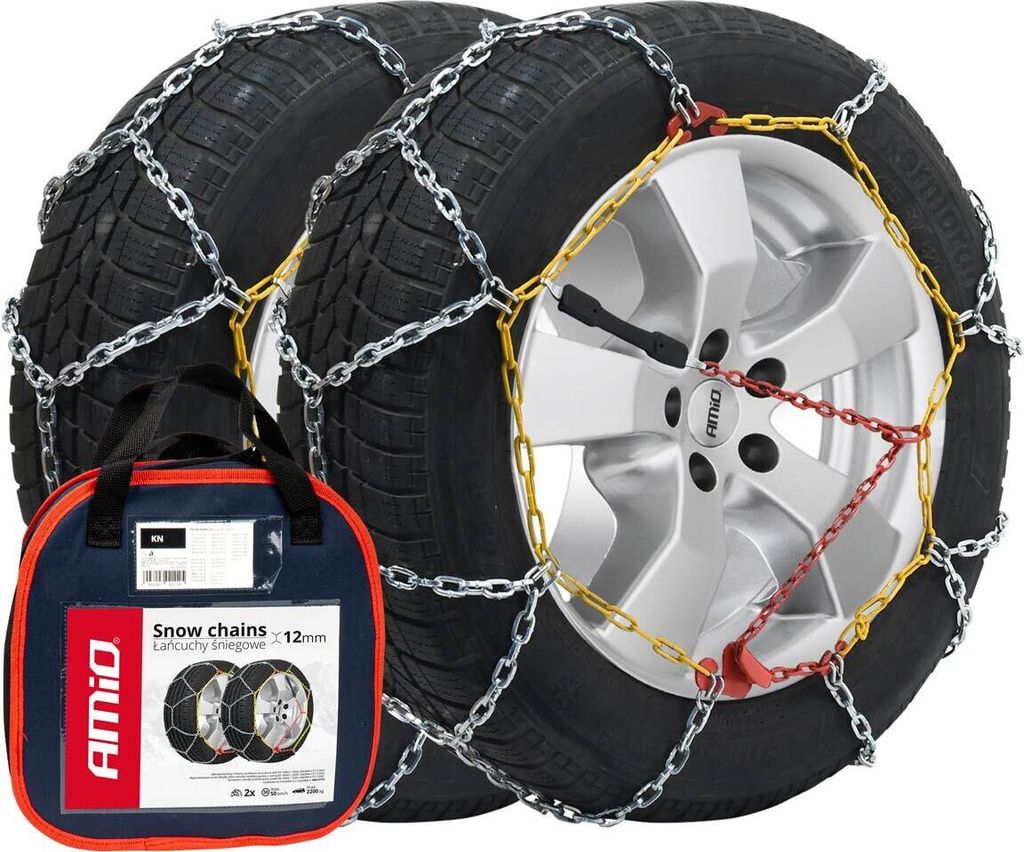 A pair of snow chains on tires, with a carrying bag in the foreground.