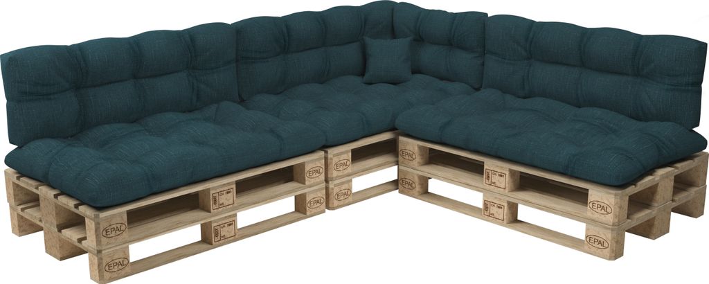 A sectional sofa made from wooden pallets and dark green cushions.