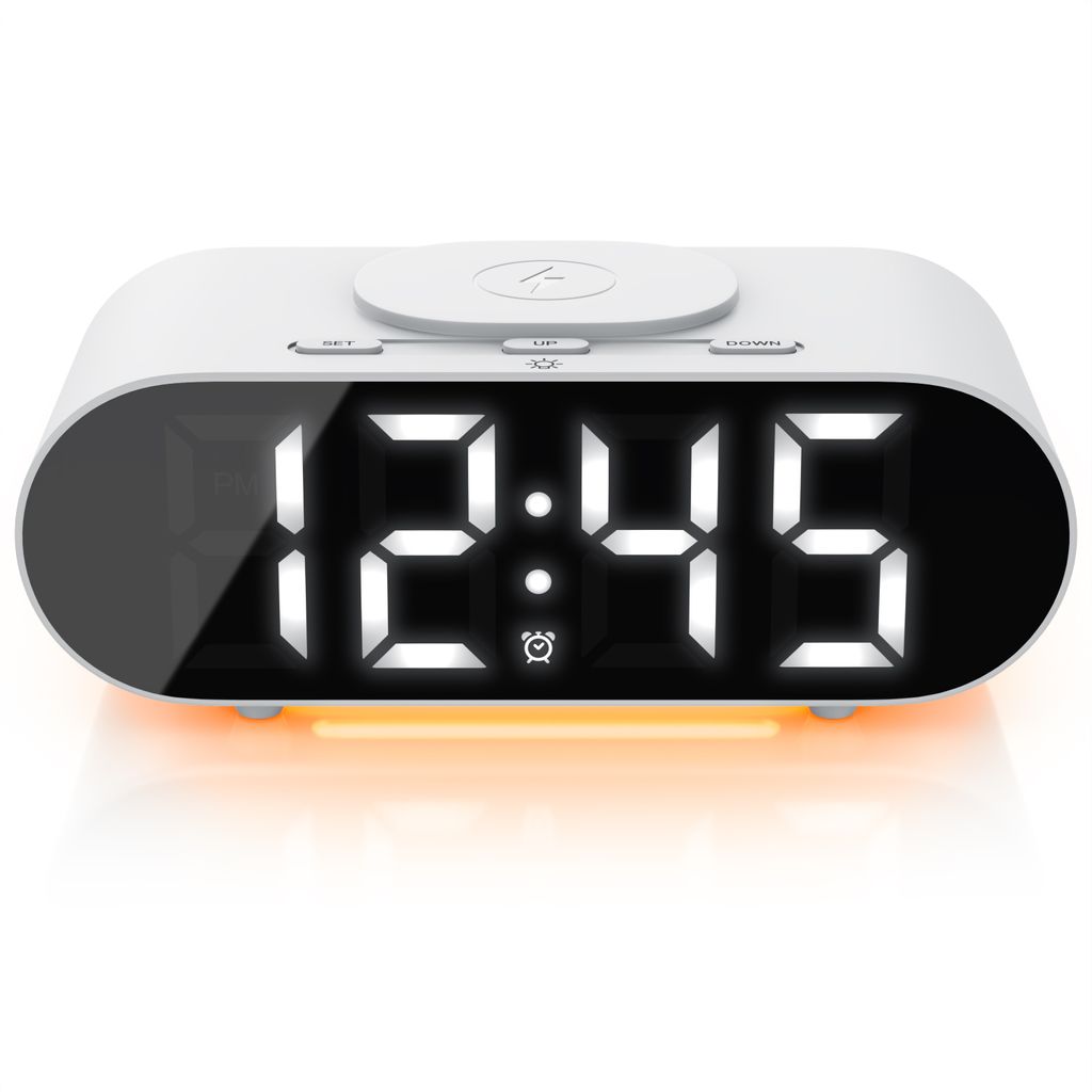 A white digital alarm clock with a digital display showing the time 12:45 and an orange LED light strip at the bottom.