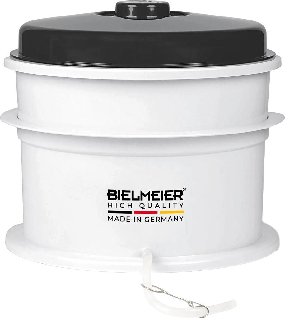 A white appliance with a black lid.
