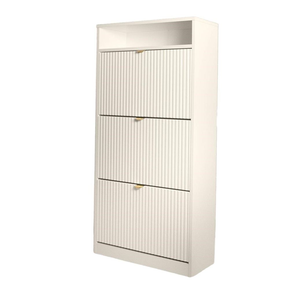 A tall, narrow, white shoe cabinet with three fluted drawers and gold handles is shown against a white background.