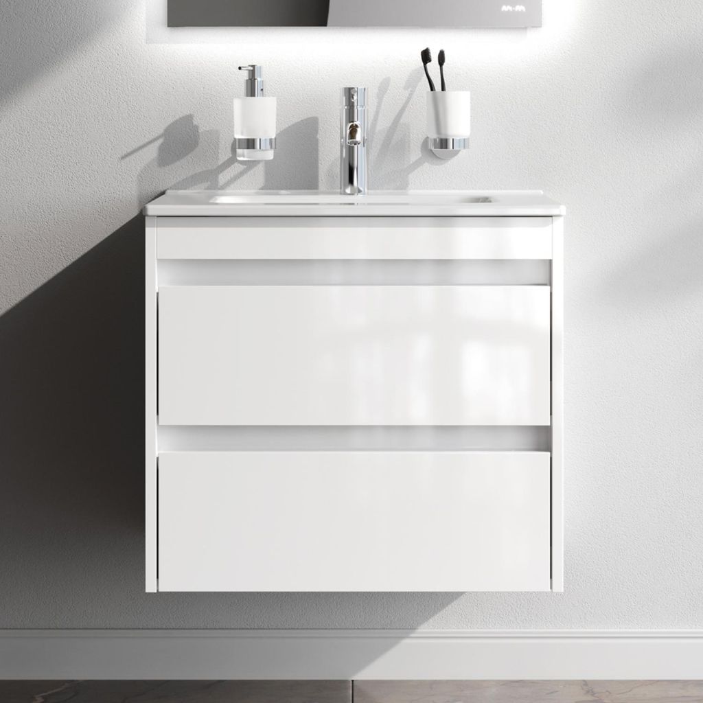 A white bathroom vanity with two drawers is mounted on a light gray wall.