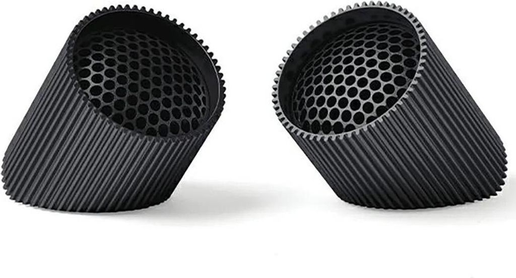 Two black cylindrical speakers with a honeycomb pattern inside are shown on a white background.