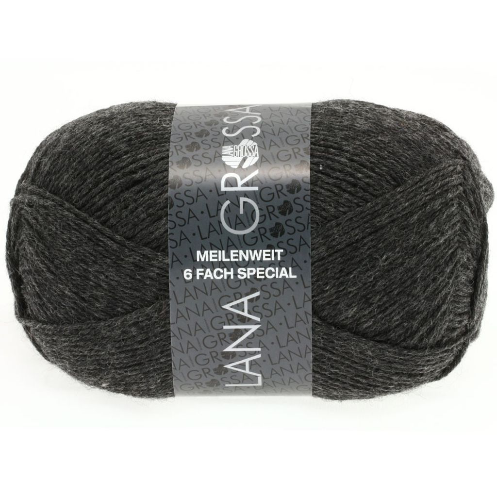A ball of dark gray yarn with a label wrapped around it.