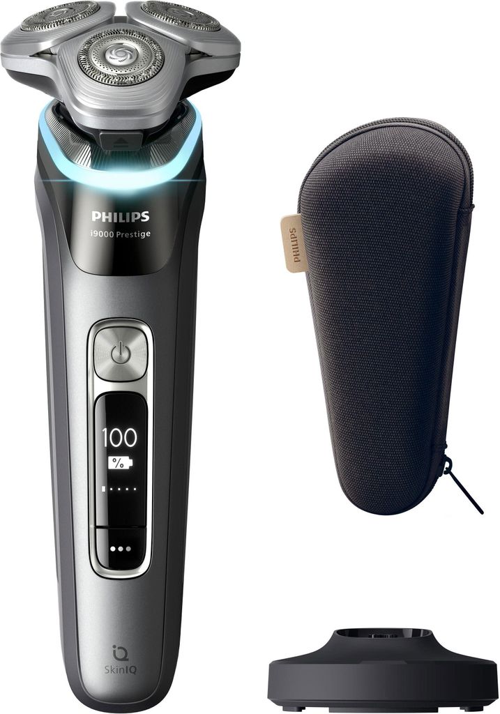A Philips Series 9000 Prestige shaver, its charging stand, and a travel case are displayed against a white background.