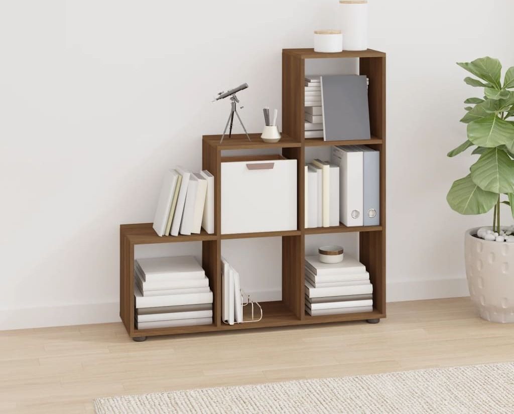 A brown wooden shelf unit with books and decorative items.