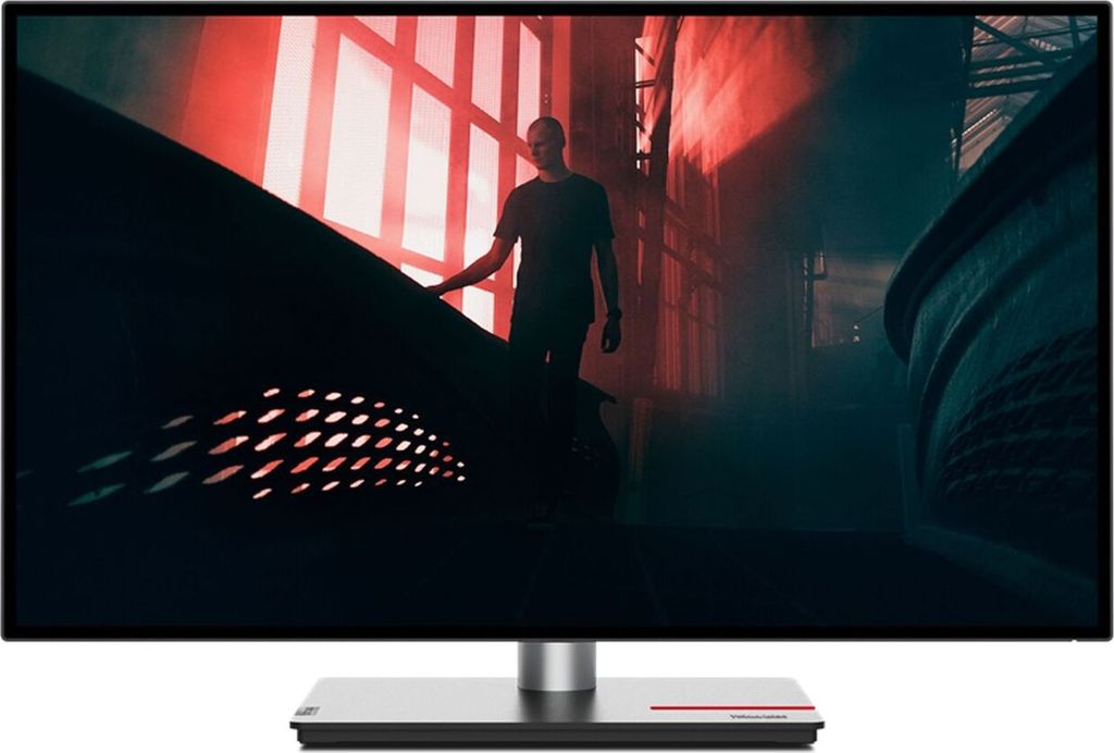A person walks down a dark staircase with red lighting.